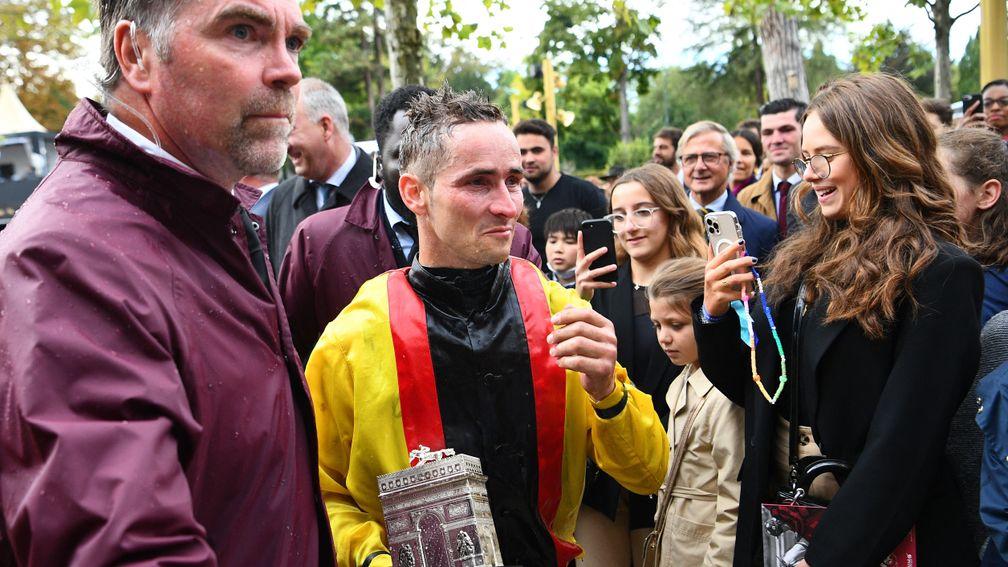 Cheers: Torquator Tasso's jockey Rene Piechulek raises a glass after his Arc victory
