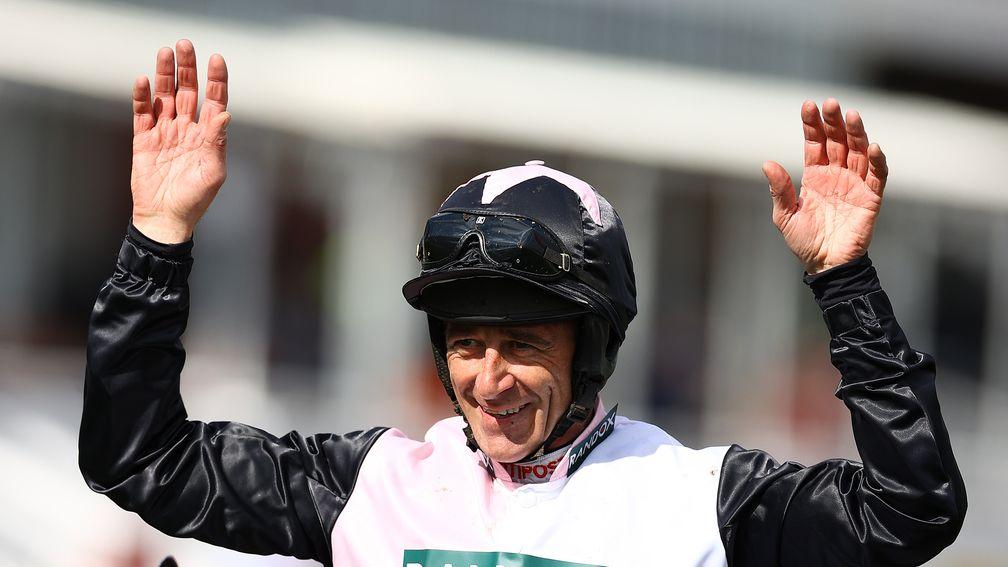 Davy Russell celebrates after riding Irish Point to victory in the Turners Mersey Novices' Hurdle