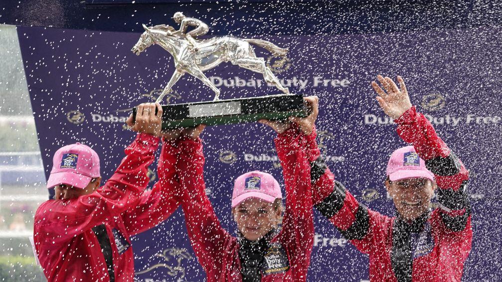 ASCOT, ENGLAND - AUGUST 11:  Jockeys, L-R, Josephine Gordon, Hollie Doyle and Hayley Turner hold the Shergar Cup aloft at Ascot Racecourse on Shergar Cup Day on August 11, 2018 in Ascot, United Kingdom. (Photo by Alan Crowhurst/Getty Images)