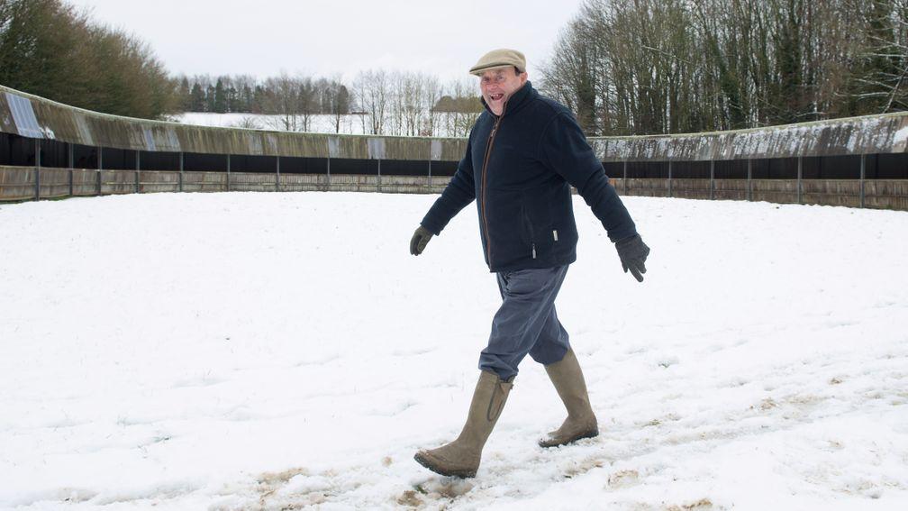 Snow man: Nicky Henderson in full stride at Seven Barrows on Monday