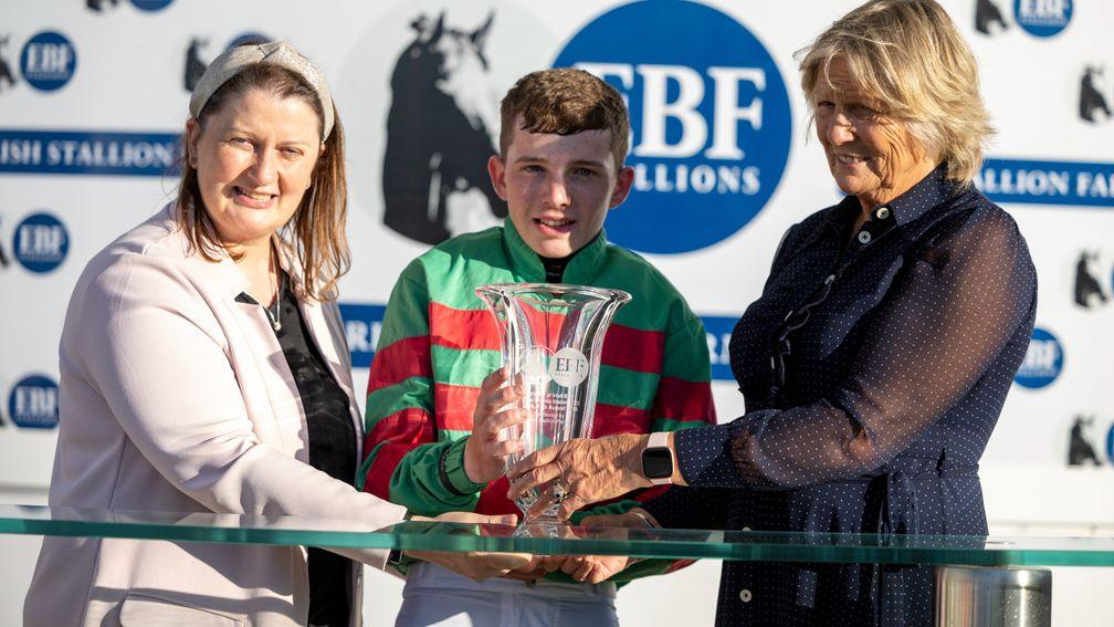 Dylan Kidd is presented with the prize for winning the Nasrullah Premier Handicap