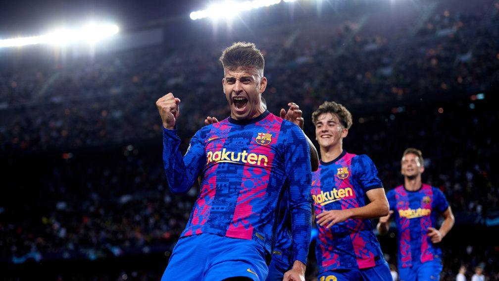 Gerard Pique celebrates his winning goal for Barcelona against Dynamo Kiev
