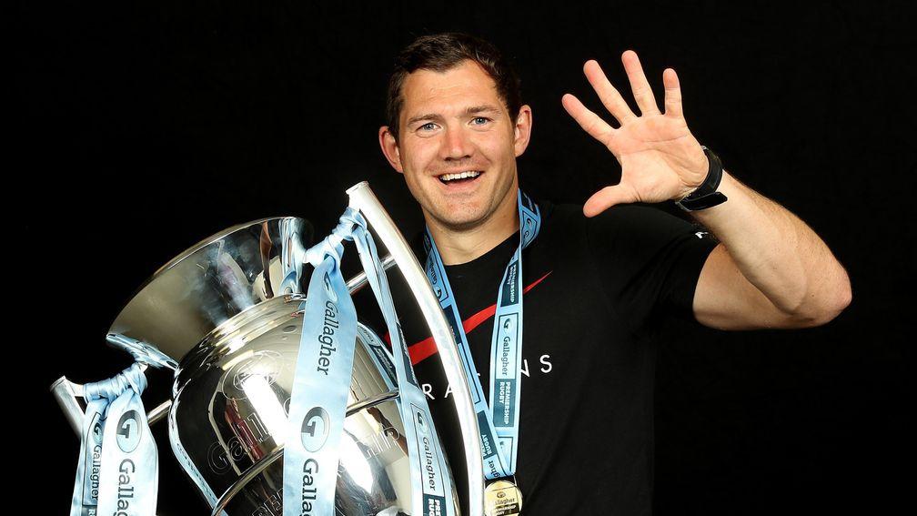 Alex Goode of Saracens celebrates with the trophy after their victory over Exeter at the Premiership Rugby final