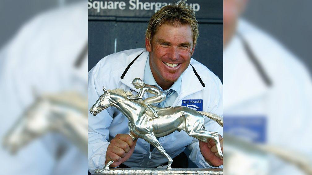 Shane Warne celebrating Shergar Cup success with the Rest Of The World team in 2004