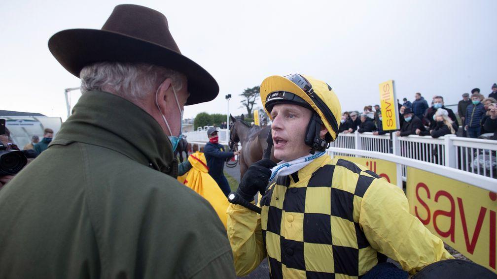 Paul Townend gives the debrief to trainer Willie Mullins following Al Boum Photo's victory
