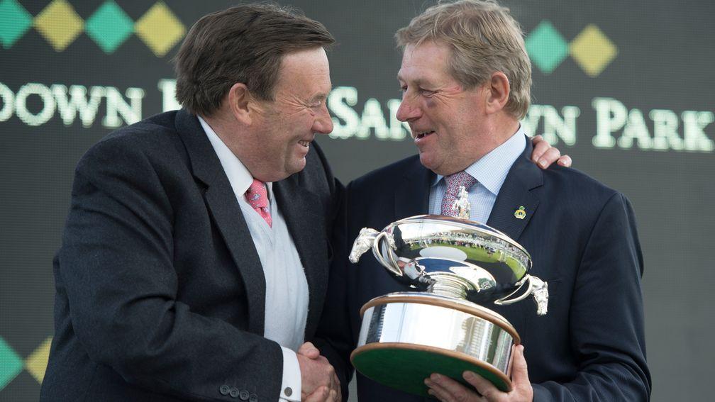 Nicky Henderson receives his fourth trainers' trophy from Olympic Gold medal winner Nick Skelton