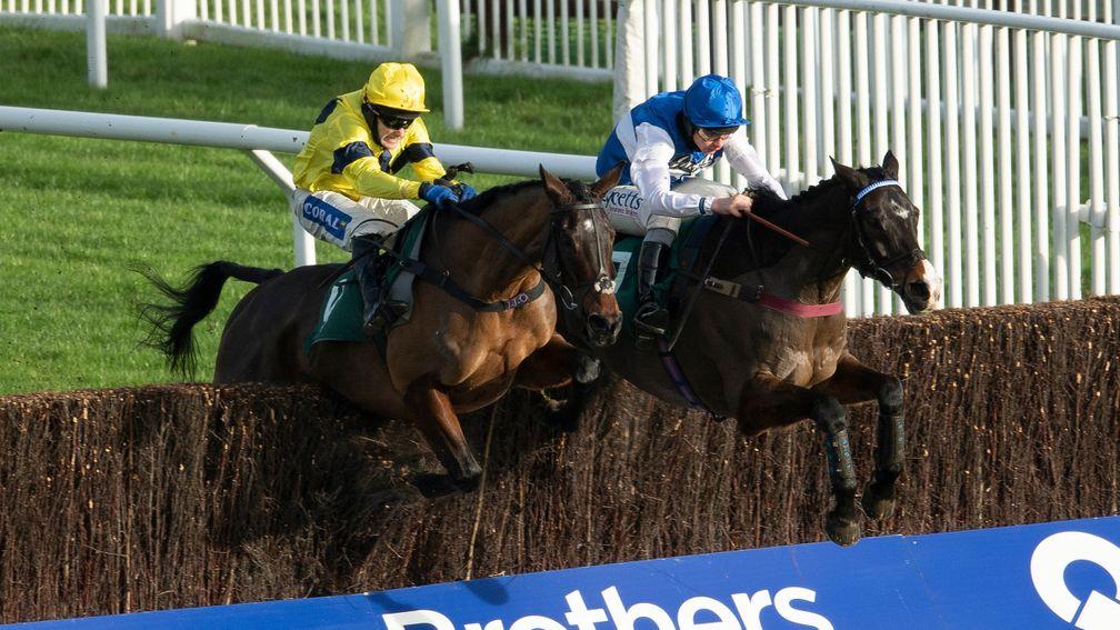 The winner Sky pirate (Tom Scudamore,left) jumps the last fence and beats Ibleo (Charlie Deutsch) in the 2m handicap chaseCheltenham 12.12.20 Pic: Edward Whitaker/Racing Post