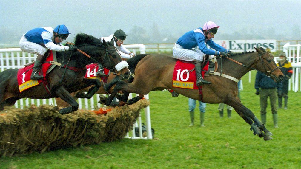 Large Action and Jamie Osborne lead over the last from winner Alderbrook in the 1995 Champion Hurdle