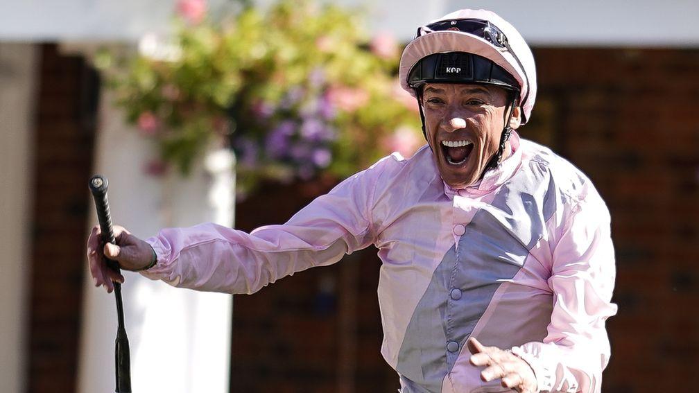 ESHER, ENGLAND - SEPTEMBER 01:  Frankie Dettori leaps from Too Darn Hot after winning The 188Bet Solario Stakes at Sandown Park on September 1, 2018 in Esher, United Kingdom. (Photo by Alan Crowhurst/Getty Images)