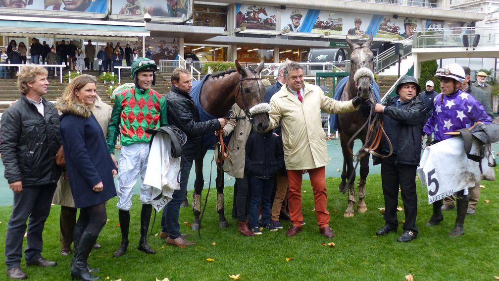 Guillaume Macaire poses with his two star four-year-olds, Master Dino (left) and Tunis, following their one-two finish in the G1 Prix Renaud du Vivier at Auteuil