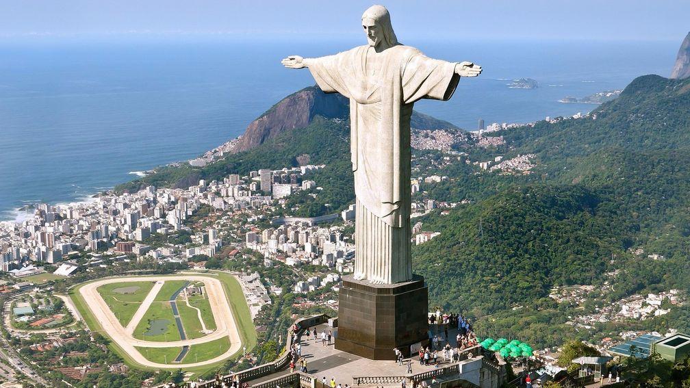 Picture-postcard setting: Gavea, Brazil's most celebrated racecourse, sits in the shadow of the arms-outstretched statue of Christ the Redeemer on Corcovado Hill in Rio de Janeiro