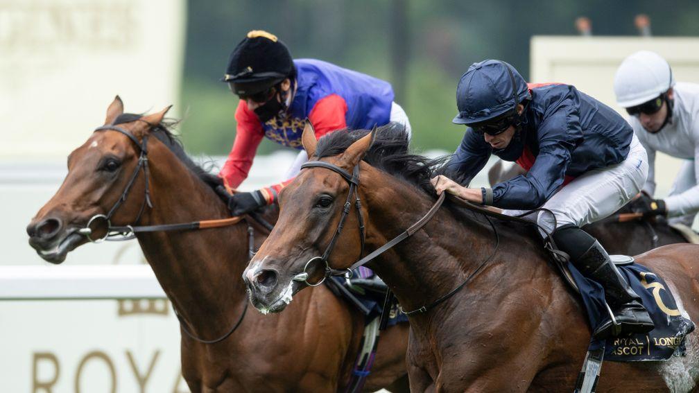 Russian Emperor and Ryan Moore (right) run down First Receiver to win the Hampton Court