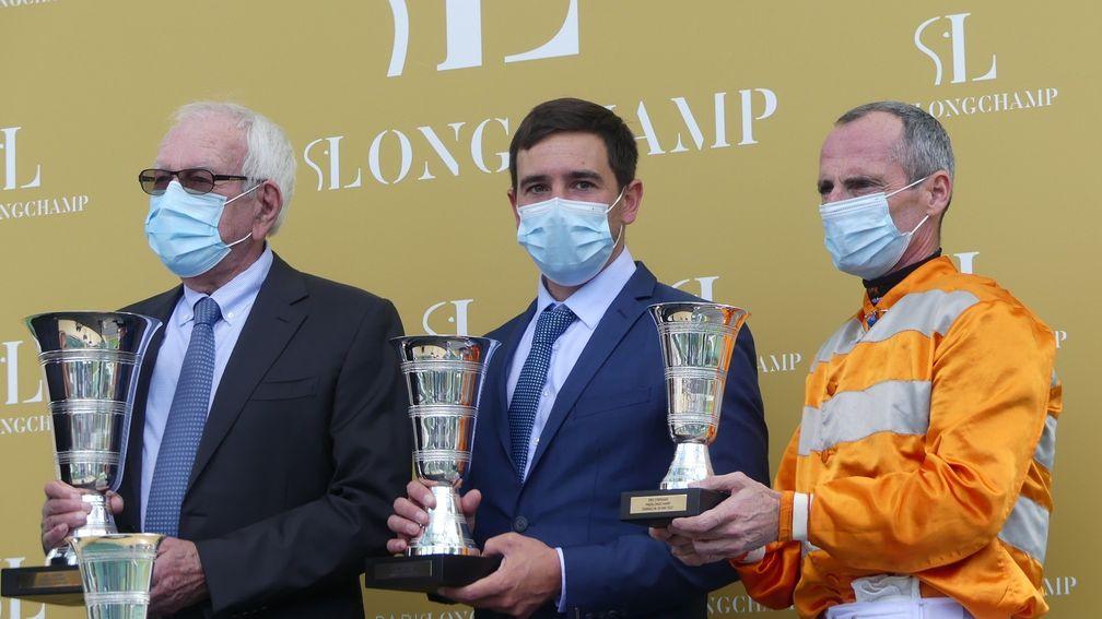 Jerome Reynier flanked by owner Jean-Claude Seroul and Gerald Mosse after Skalleti won the Prix d'Ispahan at Longchamp