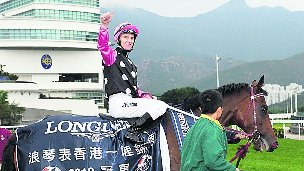 Zac Purton celebrates his victory aboard Beauty Generation in last December's Hong Kong Mile at Sha Tin