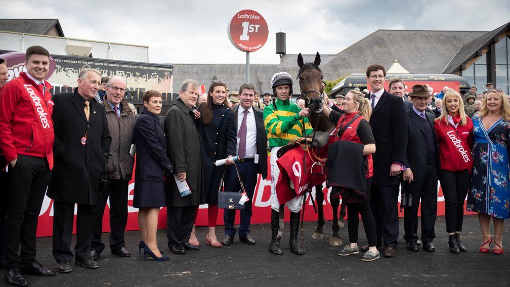 Delighted connections in the winner's enclosure with Unowhatimeanharry after the Ladbrokes Champion Stayers Hurdle