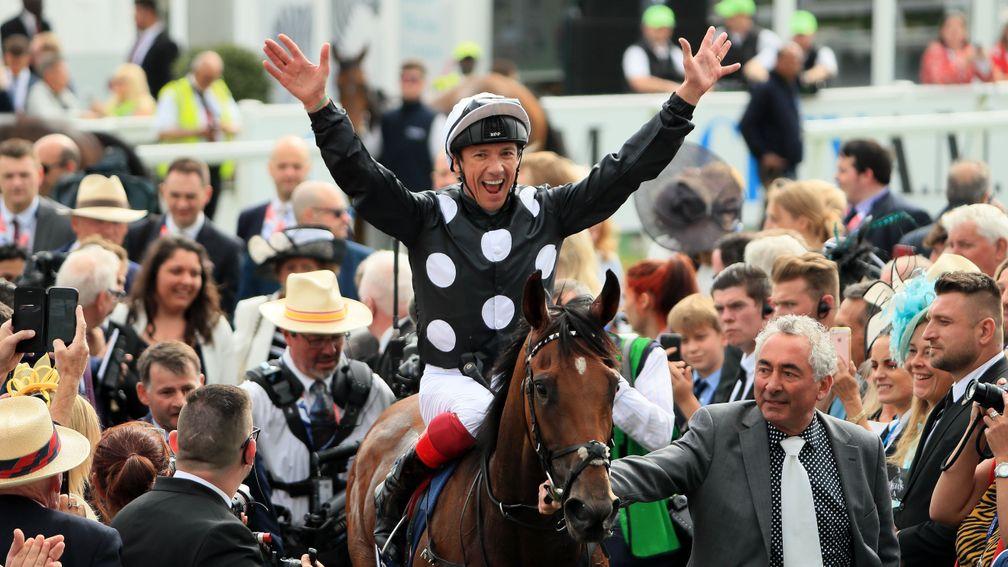 Meon Valley Stud's Mark Weinfeld (white tie) leads Anapurna into the Epsom winner's enclosure after her Oaks victory