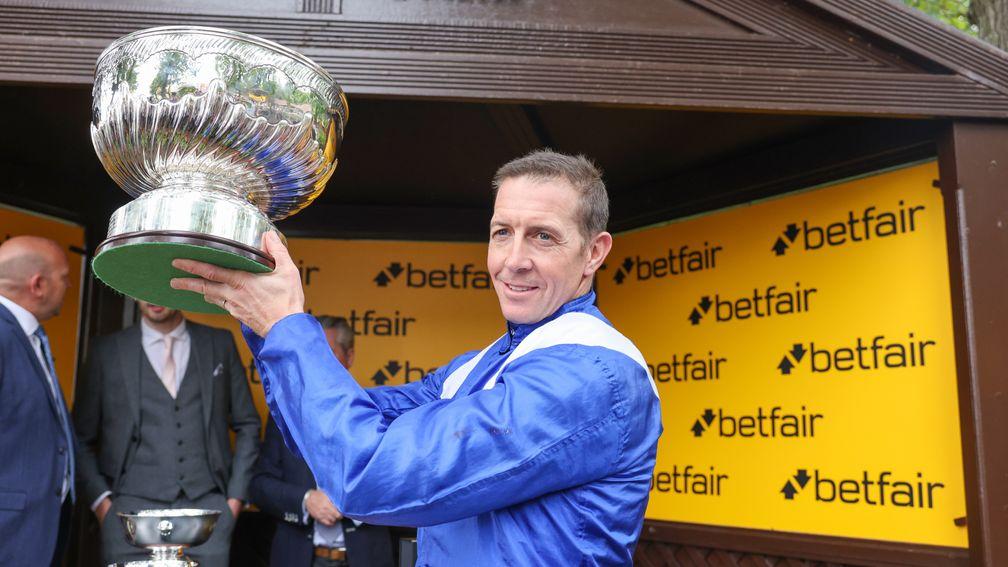 Jim Crowley poses with the Sprint Cup after Minzaal's triumph