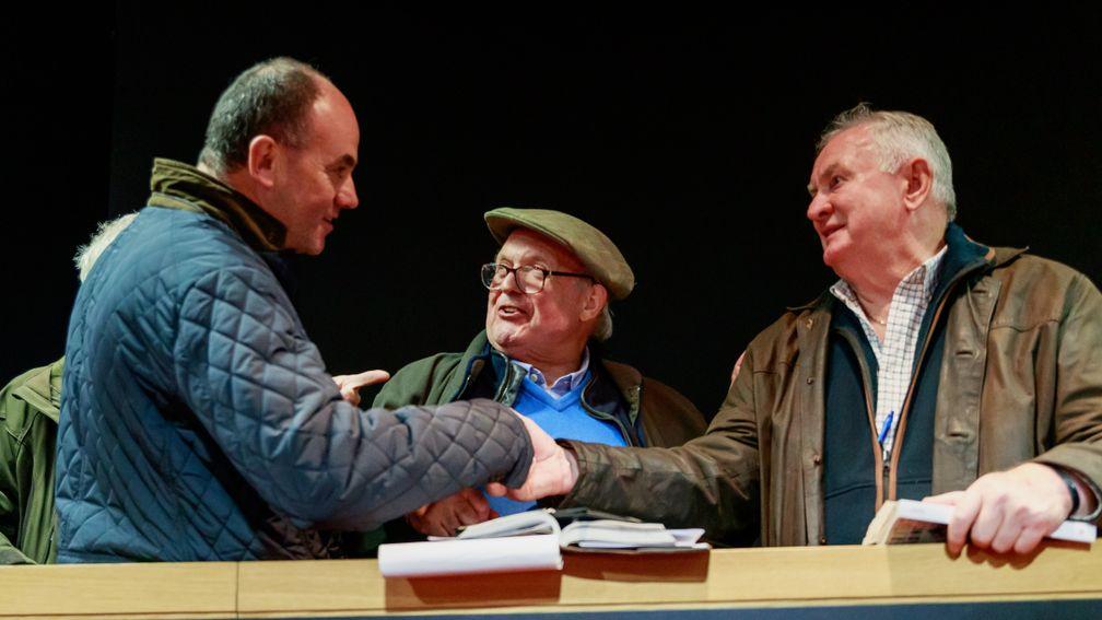 Benoit Gabeur congratulates David Minton and Dai Walters (right) after the sale of the top lot at Arqana on Tuesday
