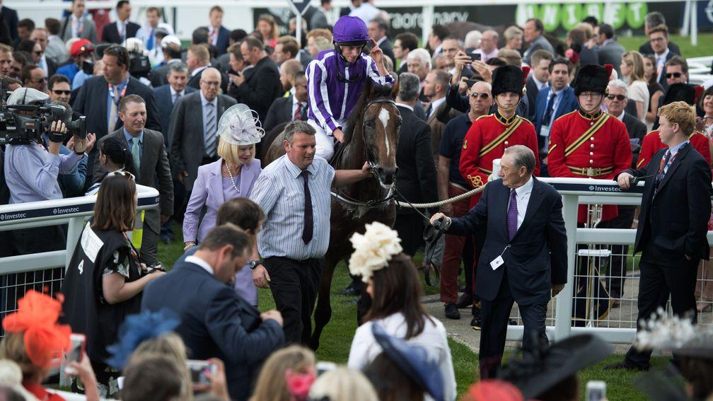 Reel rules: Highland Reel and Ryan Moore return to the winner's enclosure in front of the stands