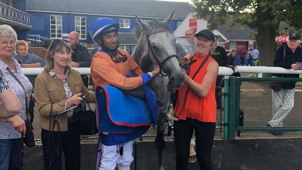 Kaiya Fraser, groom Natalie Holmes and connections pose for a photo after the apprentice rides his first winner aboard Hi Ho Silver at Leicester on Monday