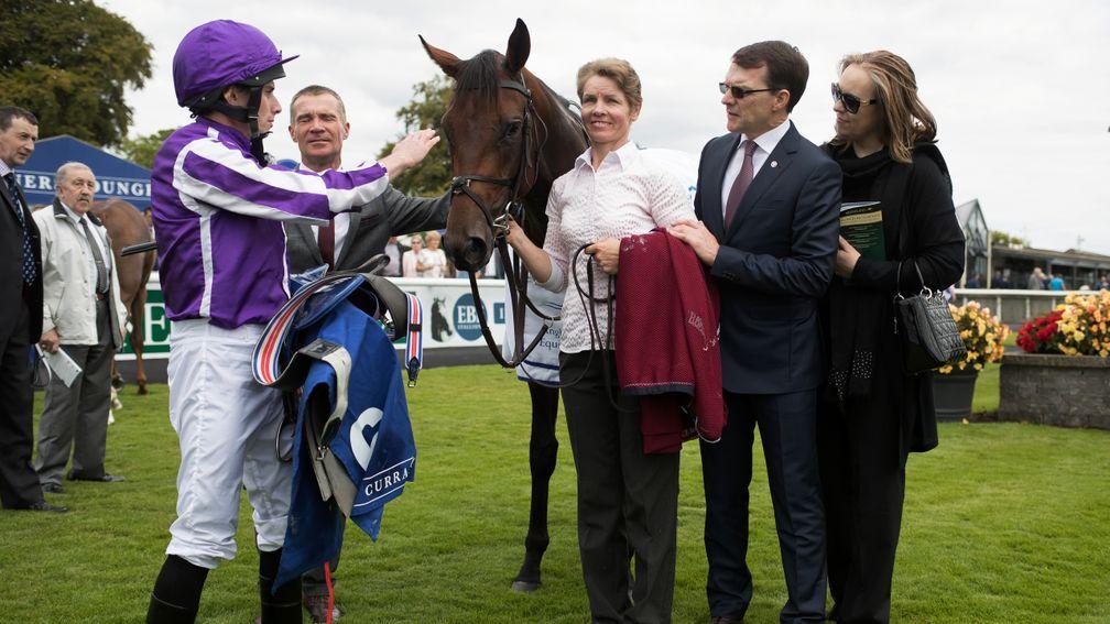 First success: Ryan Moore gives Mendelssohn a pat after victory in the 1 mile maiden
