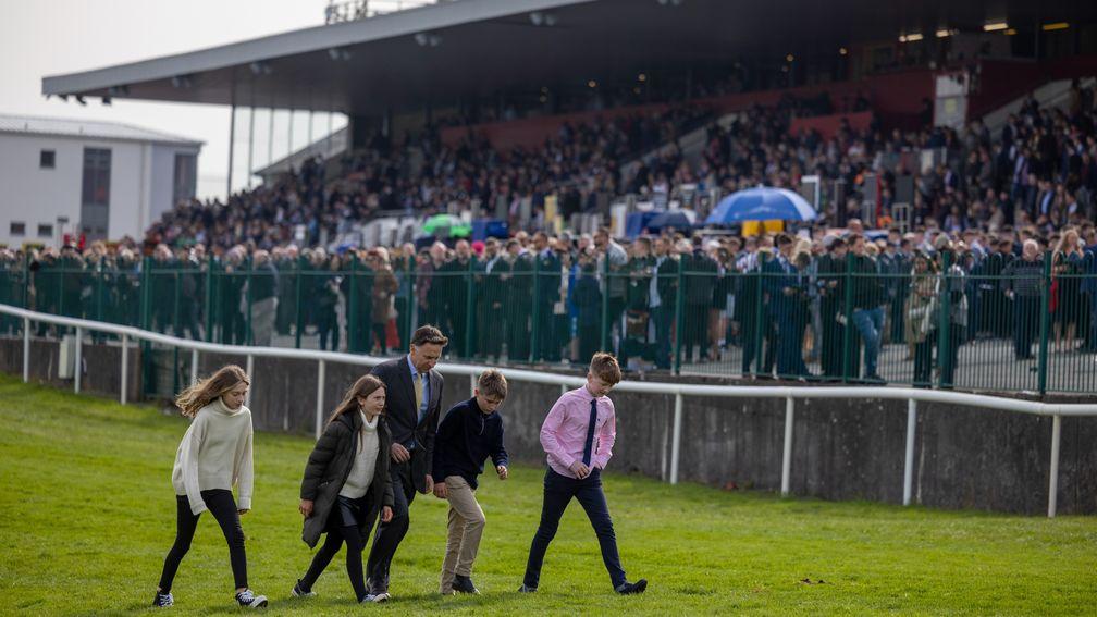 Jack de Bromhead (second from right): walks the track with his father Henry and family ahead of Honeysuckle's Grade 1 win at Punchestown in April