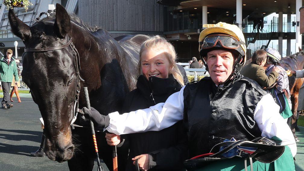 Tony Williams and Cracking Destiny and groom Robyn Crawford in the winner's enclosure after the Aintree charity race