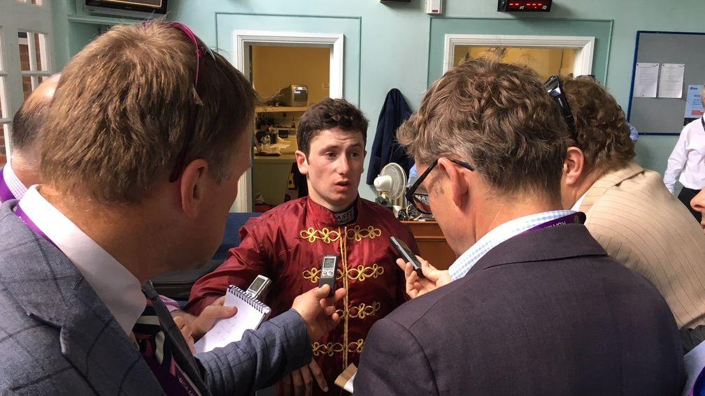 Oisin Murphy debriefs the press in Sandown's weighing room after winning the Coral-Eclipse