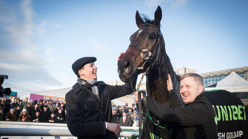 Joseph O'Brien gives Edwulf a well-deserved pat after winning the Irish Gold Cup