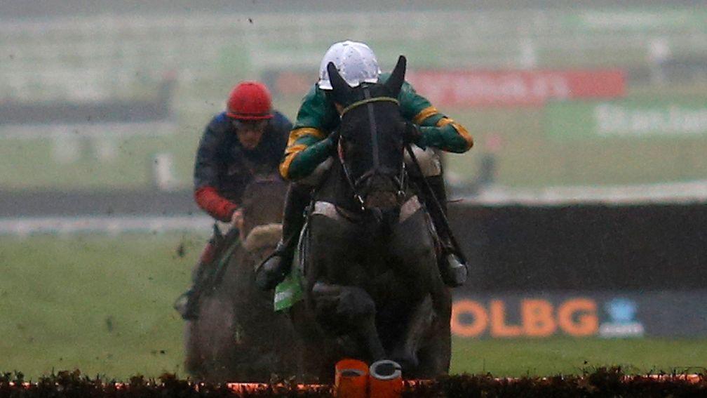 CHELTENHAM, ENGLAND - DECEMBER 10: Richard Johnson riding The New One (L) clear the last to win The International Hurdle Race from My Tent Or Yours (R) at Cheltenham Racecourse on December 10, 2016 in Cheltenham, England. (Photo by Alan Crowhurst/Getty Im