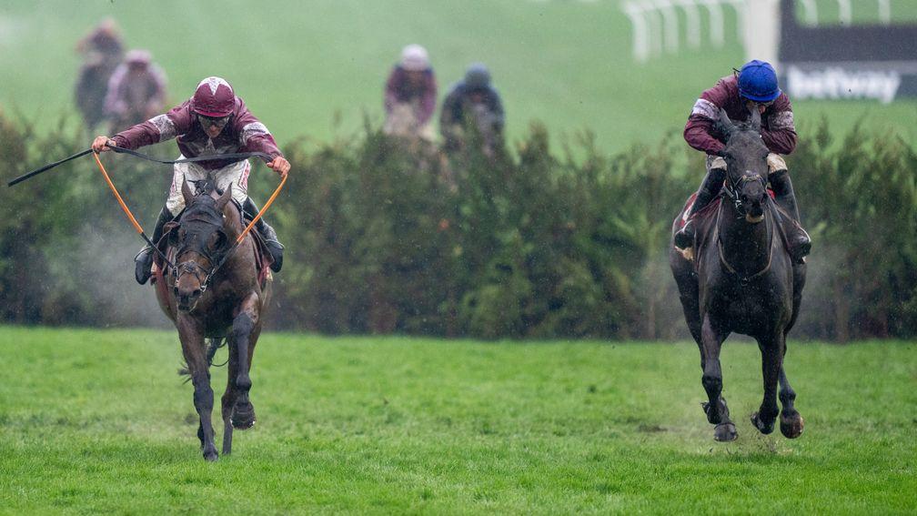 Tiger Roll (left) and Delta Work race up the hill in the 2022 cross-country at Cheltenham