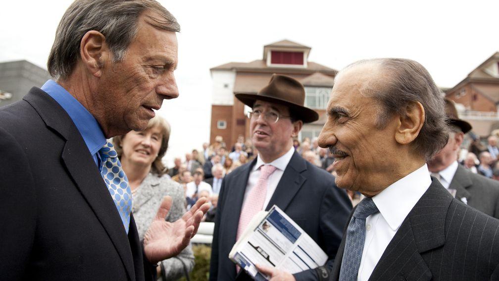 Abdullah (right) speaks to Sir Henry Cecil at Newbury