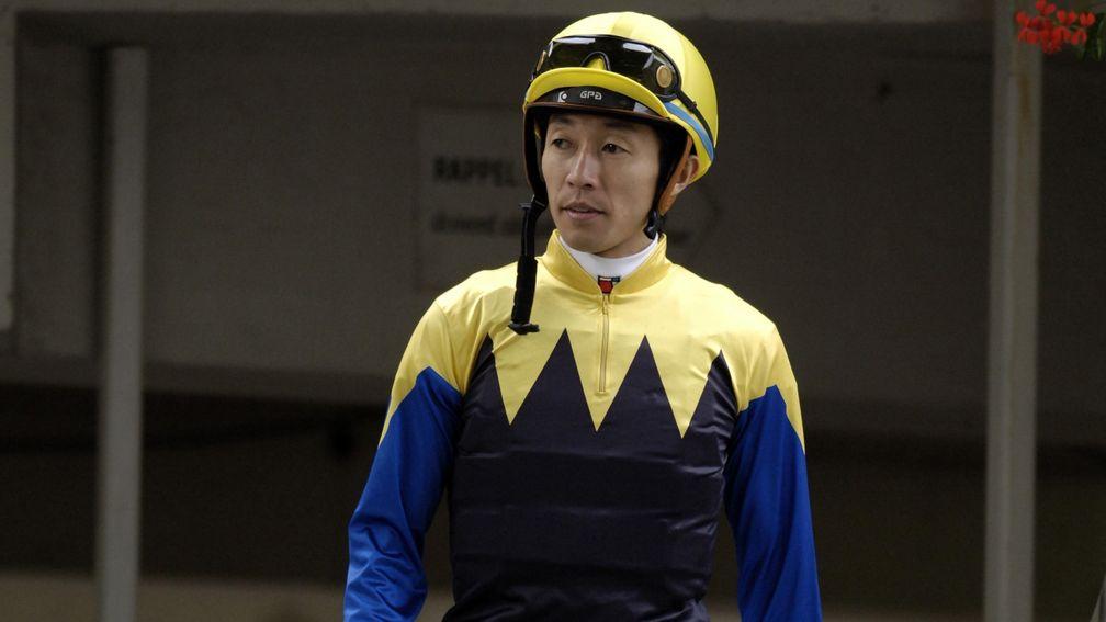 Yutaka Take on his way out to ride Deep Impact in the 2006 Prix de l'Arc de Triomphe at Longchamp