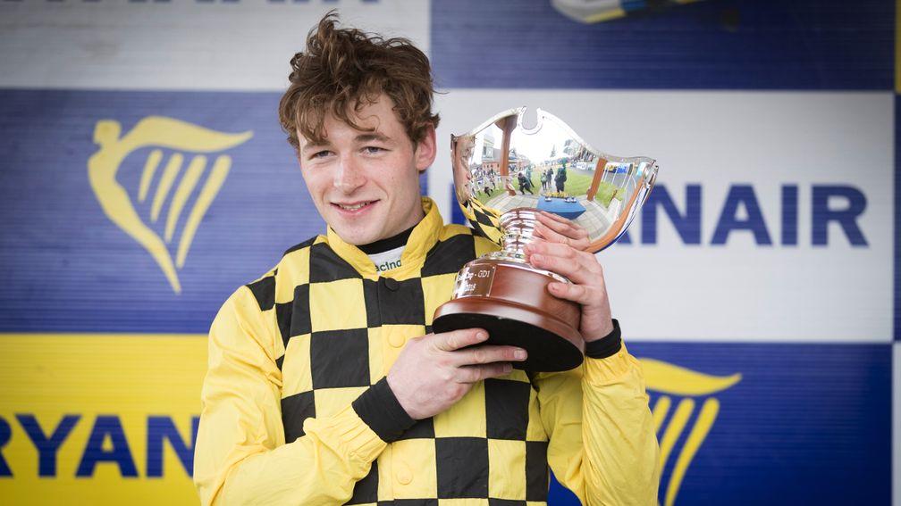 David Mullins celebrates with the trophy after winning the Ryanair Gold Cup aboard Al Boum Photo