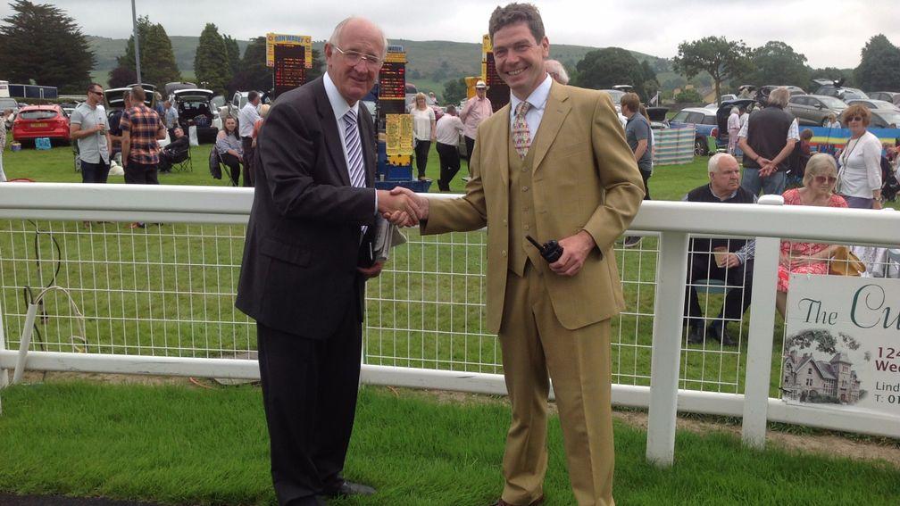 Ron Wadey (left, with racecourse managing director Jonathan Garratt) celebrated 50 years as a bookmaker by sponsoring a race at Cartmel