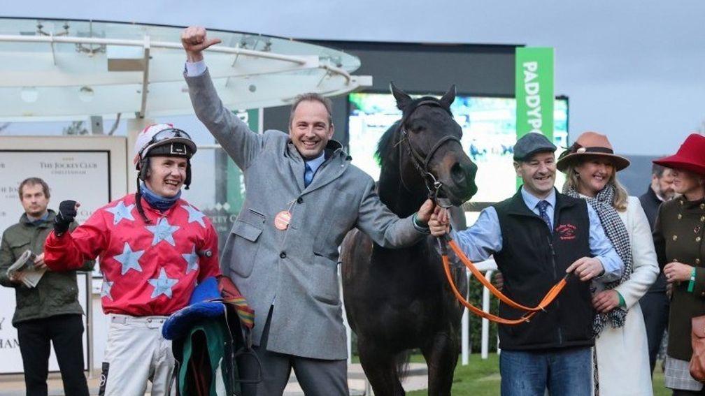 Philip Rothwell (second from left) punches the air after MC Alpine's victory at Cheltenham on Friday