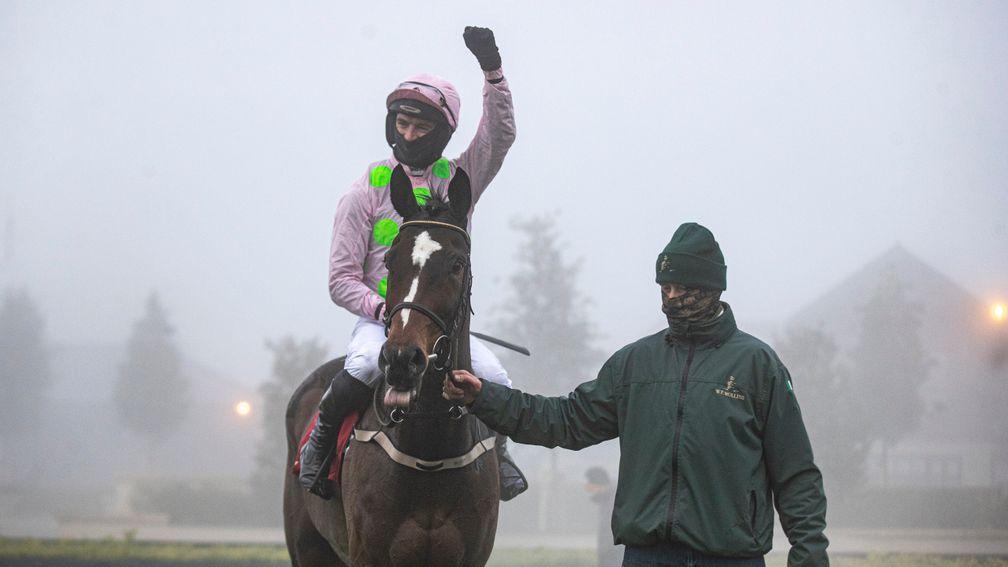 Min and Patrick Mullins are led in amongst the Punchestown fog which forced the rest of the card to be abandoned