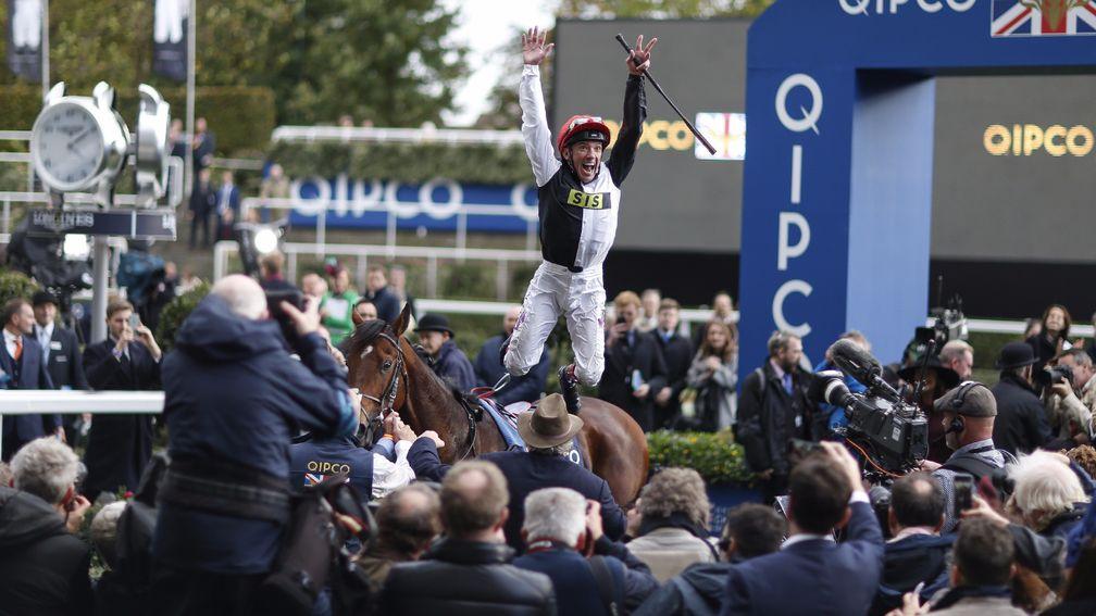 Dettori is walking on air as the crowd packs around the winner's enclosure
