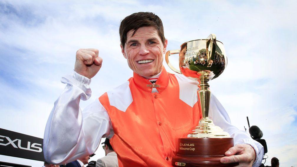 Craig Williams celebrates with the Melbourne Cup
