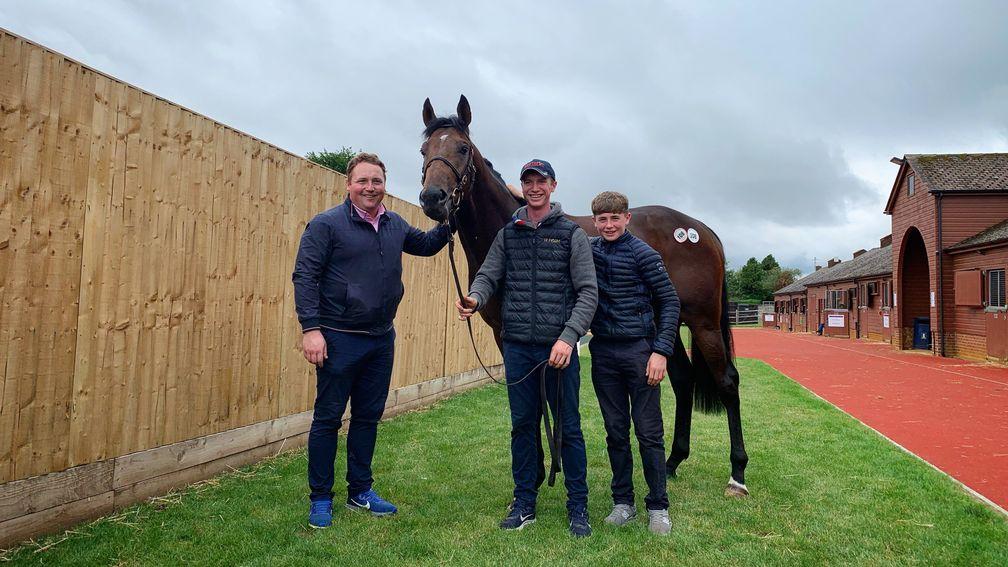 Brian Slattery (from left) with Luke and Jake Coen and the sales-topping Excelebration colt