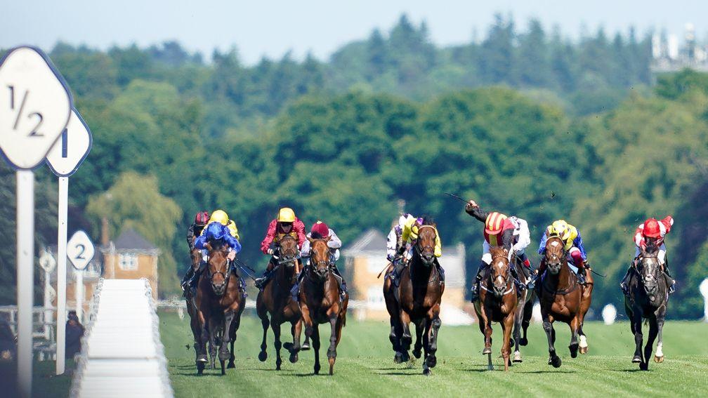 ASCOT, ENGLAND - JUNE 14: William Buick riding Coroebus (L, blue) win The St James's Palace Stakes during Royal Ascot 2022 at Ascot Racecourse on June 14, 2022 in Ascot, England. (Photo by Alan Crowhurst/Getty Images)