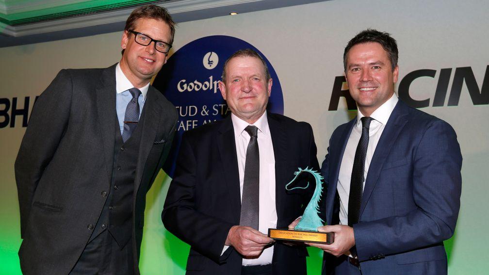 William Reddy receiving his award from Ed Chamberlain and Michael Owen at the Godolphin Stud & Stable awards last year