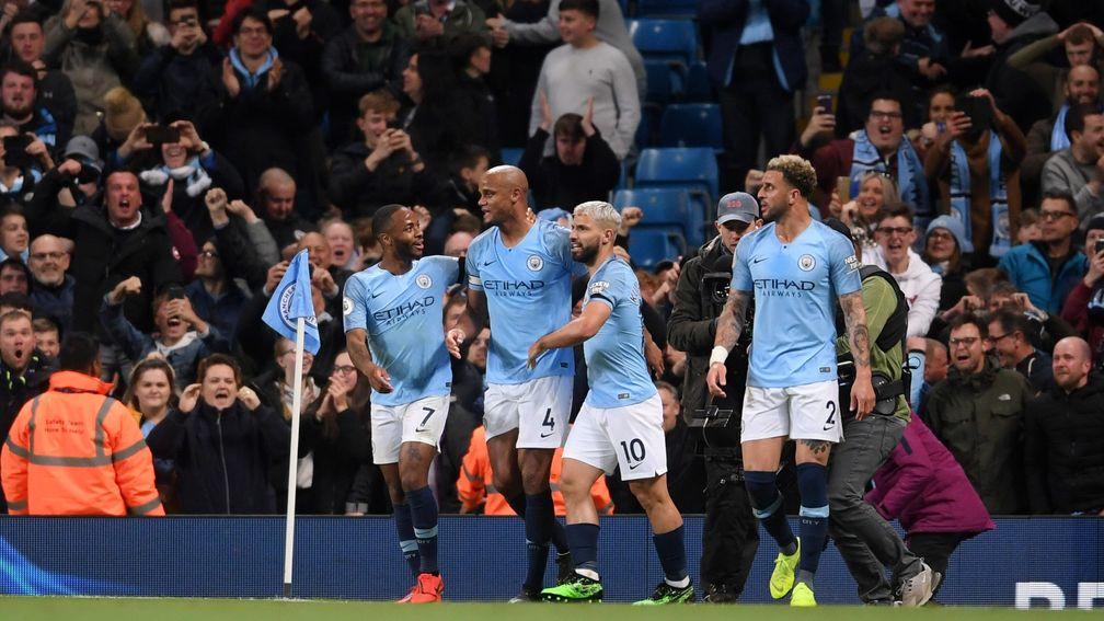 Manchester City teammates help Vincent Kompany celebrate his wonderstrike against Leicester