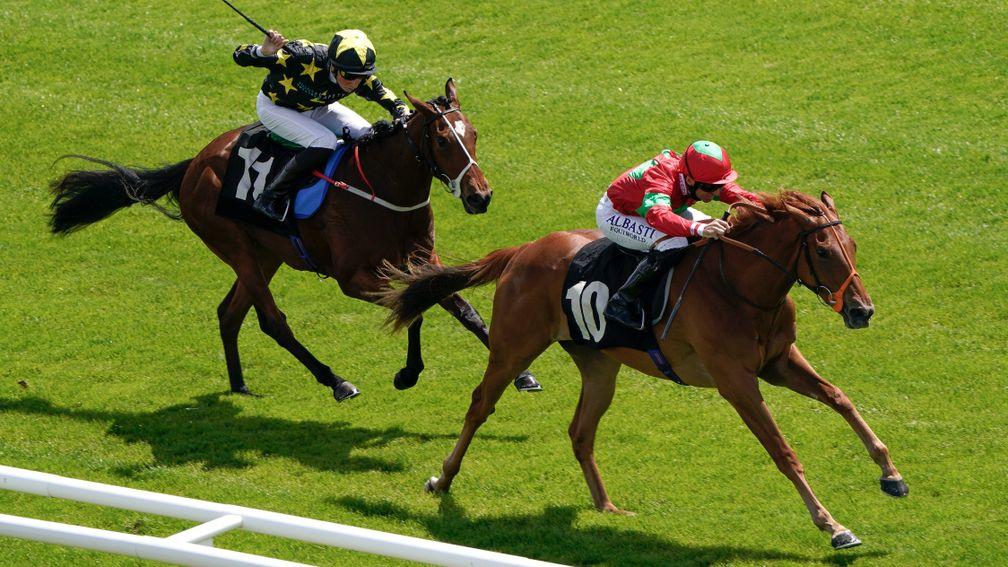 NEWBURY, ENGLAND - MAY 31: Pat Dobbs riding Rich (red/green) win The Make Your Best Bet At BetVictor Restricted Maiden Fillies' Stakes at Newbury Racecourse on May 31, 2022 in Newbury, England. (Photo by Alan Crowhurst/Getty Images)