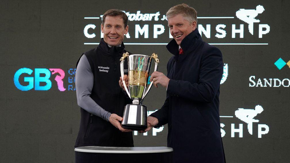 Richard Johnson (left) accepts his honour off former colleague Noel Fehily