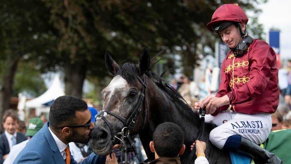 Sealed with a kiss: owner Sheikh Fahad is on hand to greet Roaring Lion in the winner’s enclosure