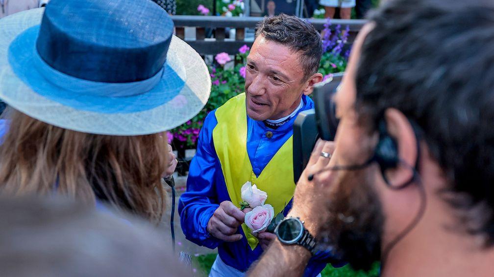 Frankie Dettori with his roses after Mighty Ulysses won the Listed Sir Henry Cecil Stakes at Newmarket