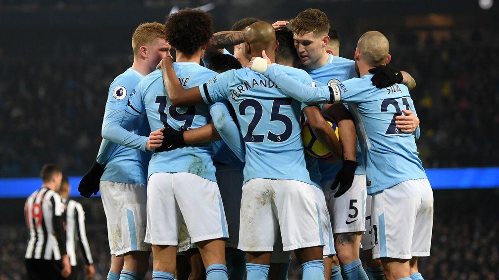 Premier League leaders Manchester City celebrate their win over Newcastle