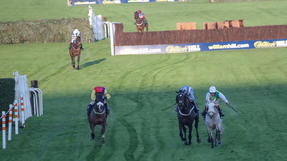 Lake View Lad (right) edges out Santini (centre) and Native River in the Many Clouds Chase at Aintree
