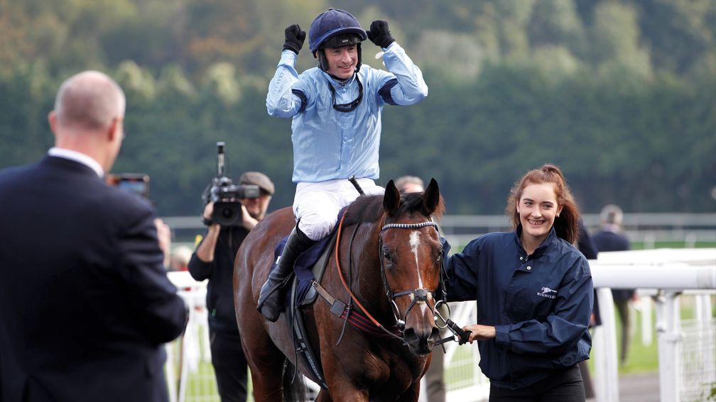 A jubilant Tom O'Brien returns to the winner's enclosure after winning the feature aboard Orbys Legend